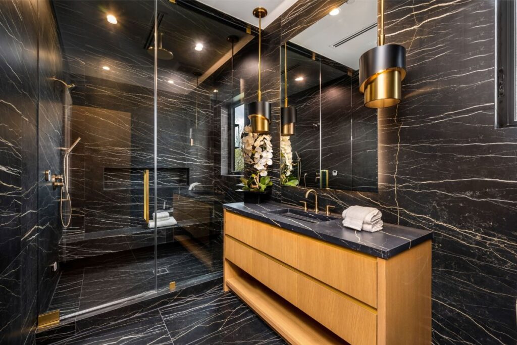 Home Spa-inspired primary bathroom designed with natural stone, custom vanity, and refined finishes by Redefined Kitchens & Bath in Arizona